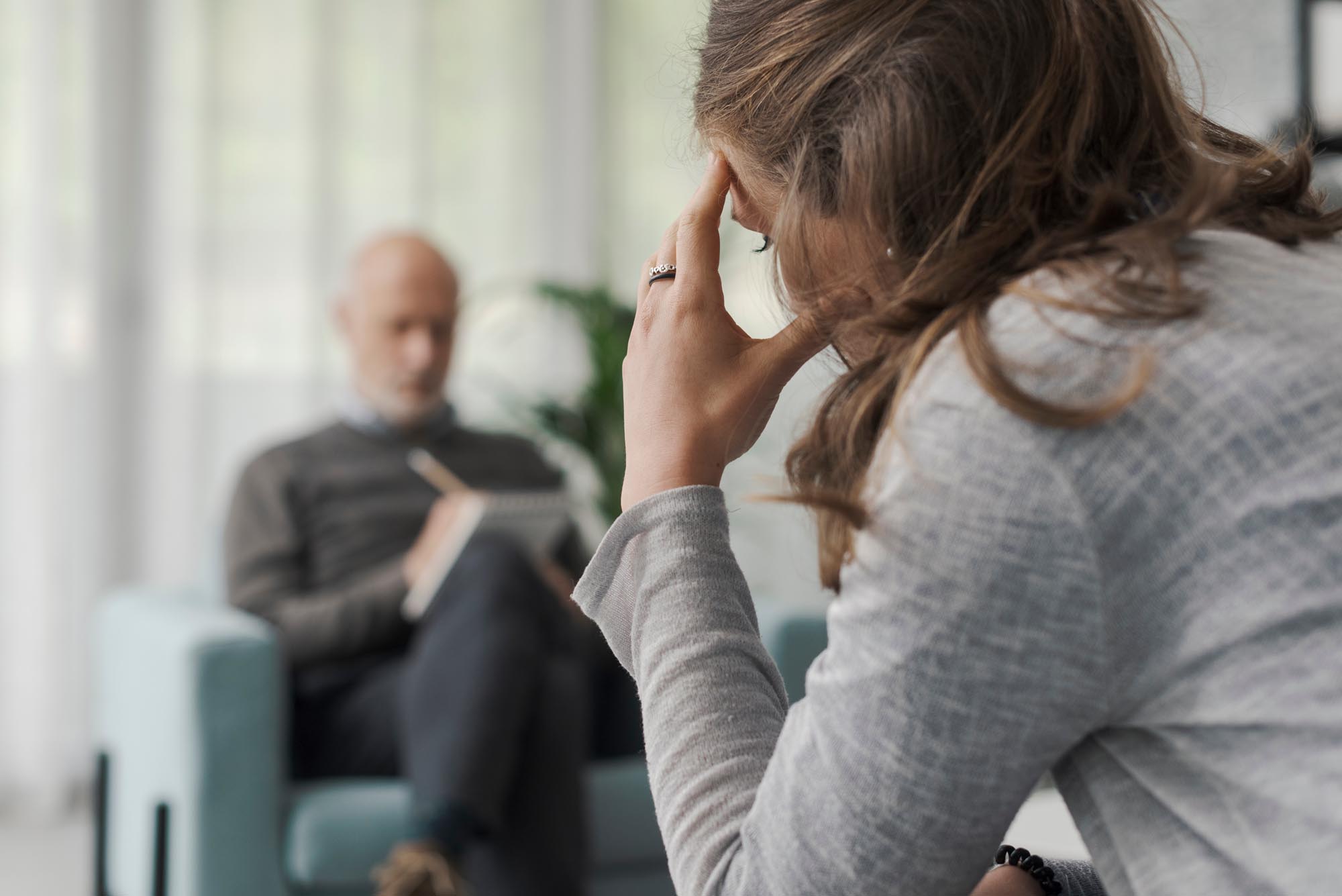 Psychologist Writing Notes During A Therapy Session DBT Psychiatric Evening Treatment Program